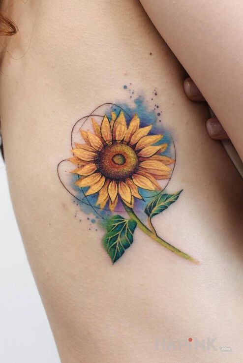 Tattoo Slonecznik z dodatkiem akwareli in colorful motif and Watercolor style on the ribs