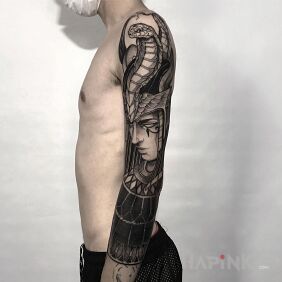 Tattoo Egyptian priestess on the upper arm motif: faces style: graphic / illustrative