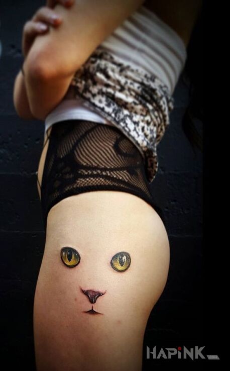 Tattoo Kocie oczy in animals motif on the leg