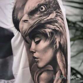 Tattoo Eagle woman on the upper arm motif: black and gray style: realistic