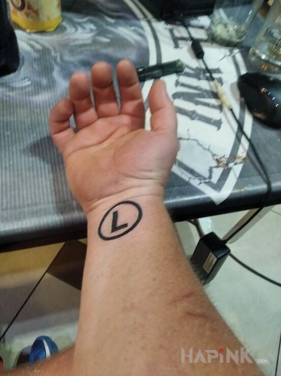 Tattoo LEGIA in other motif and minimalistic style on the wrist