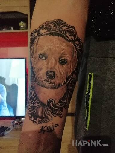 Tattoo Kaja in black and gray motif and realistic style on the forearm