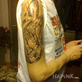 Tattoo Rosary and cross on the upper arm motif: black and gray style: realistic