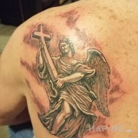 Tattoo Angel with a cross in hands on the back motif: angels style: graphic / illustrative