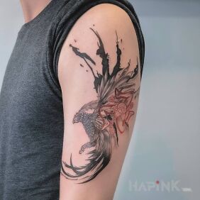 Tattoo Phoenix On the arm motif: fantasy style: graphic / illustrative