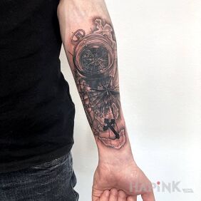 Tattoo Covering an old tattoo with a compass On the arm motif: religious style: realistic