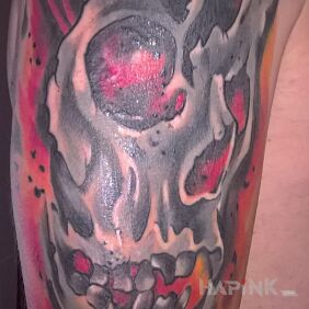 Tattoo Skull blown apart by a rose on the upper arm motif: skulls