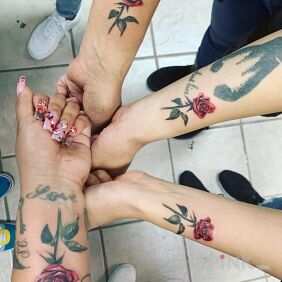 Tattoo Sisterly little roses ???? on the forearm motif: colorful style: realistic