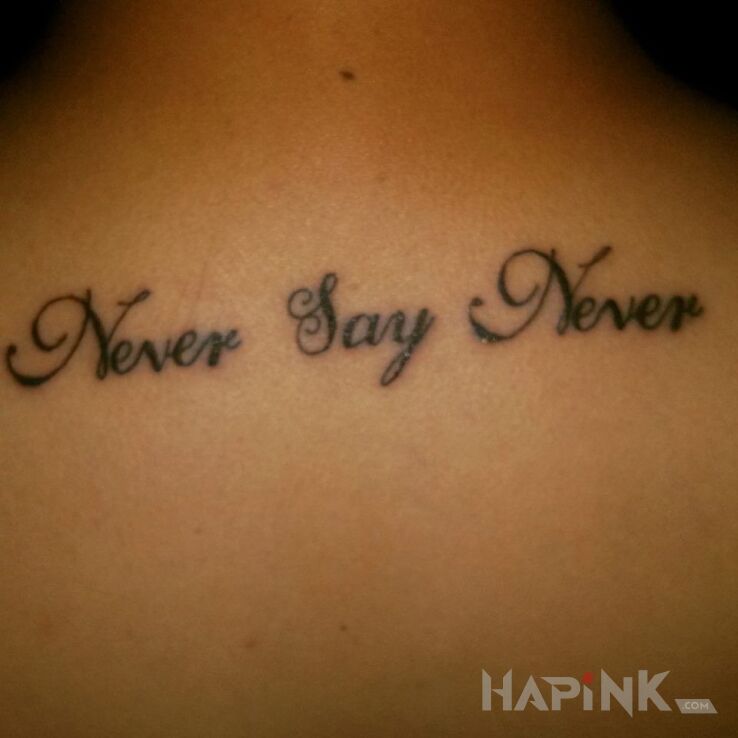 Tattoo Nigdy nie mów Nigdy ;) in lettering motif on the hand