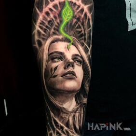 Tattoo A green leaf sprouting from the forehead on the forearm motif: 3D style: realistic