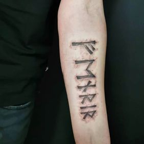 Tattoo Fenrir on the forearm motif: black and gray style: Celtic / Nordic