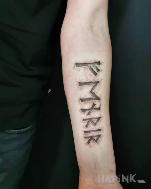 Tattoo Fenrir in black and gray motif and Celtic / Nordic style on the forearm