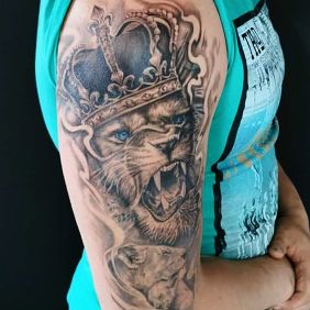 Tattoo Lion King family On the arm motif: black and gray style: realistic