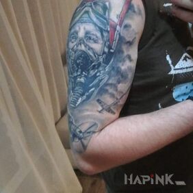 Tattoo Pilot and WWII air battle on the upper arm motif: faces style: realistic