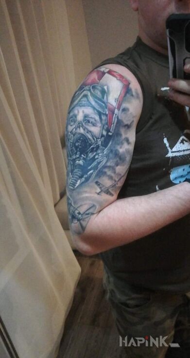 Tattoo Pilot i bitwa powietrzna WWII in faces motif and realistic style on the upper arm