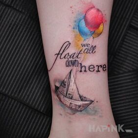 Tattoo Paper boat and baloney on the forearm motif: lettering