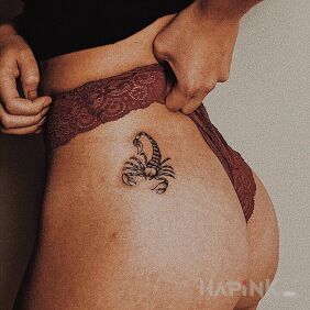 Tattoo Small scorpion on the buttocks motif: black and gray style: realistic