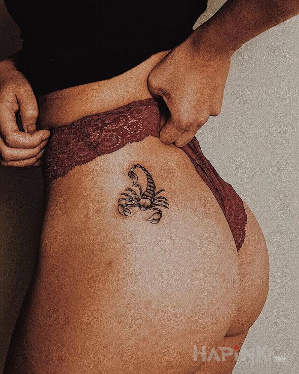 Tattoo Mały skorpion in black and gray motif and realistic style on the buttocks