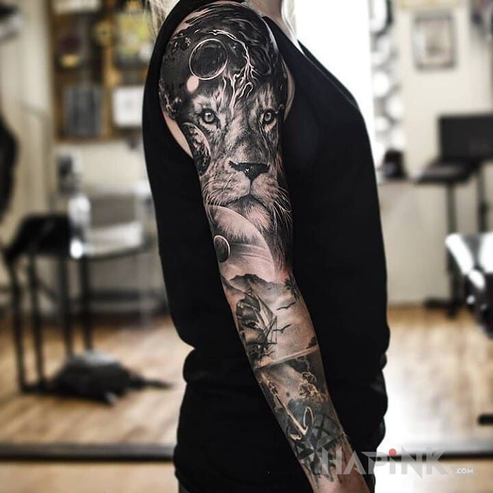 Tattoo Lwisko in black and gray motif and realistic style on the forearm