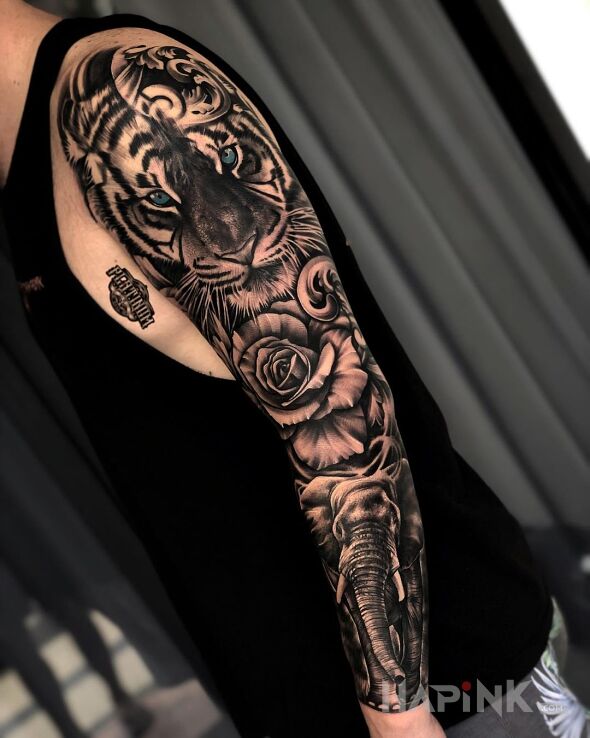 Tattoo Tygrys na górze, słoń na dole in sleeves motif and realistic style on the forearm