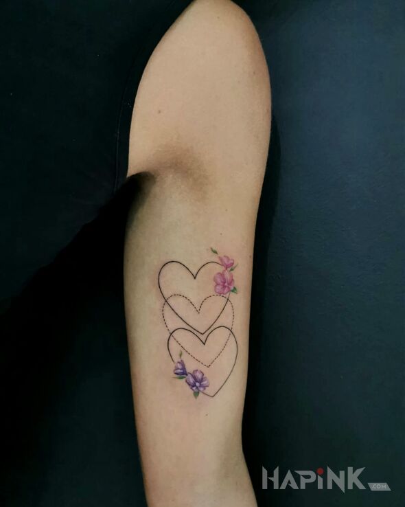 Tattoo Hearts flowers family in flowers motif and graphic / illustrative style on the bicep
