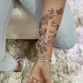 Wycena tatuażu - Wycena tatuażu napis i kwiaty z krzyżem
