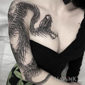 Tattoo Sharp snake in resistance on the forearm motif: black and gray style: graphic / illustrative
