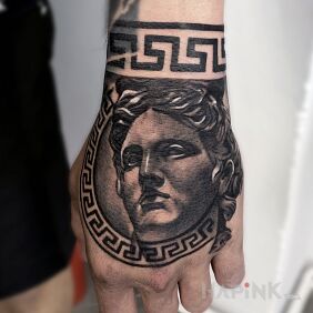 Tattoo Apollo On the arm motif: black and gray style: realistic