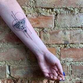 Tattoo Microrealism On the arm motif: black and gray style: geometric