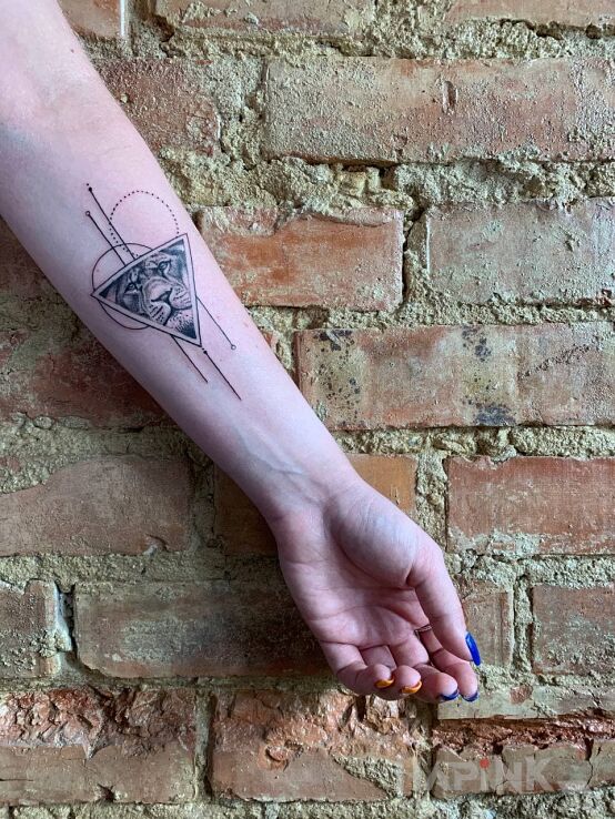 Tattoo Microrealism in black and gray motif and geometric style On the arm