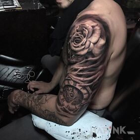 Tattoo Rose & Clock on the upper arm motif: flowers style: realistic