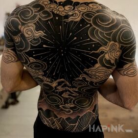 Tattoo Black hole on the shoulder blades motif: black and gray style: blackwork / blackout
