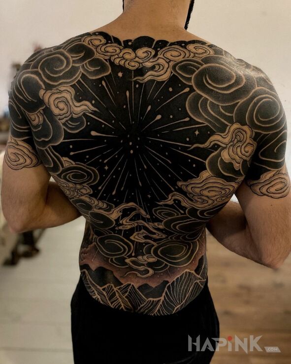 Tattoo Czarna dziura in black and gray motif and blackwork / blackout style on the shoulder