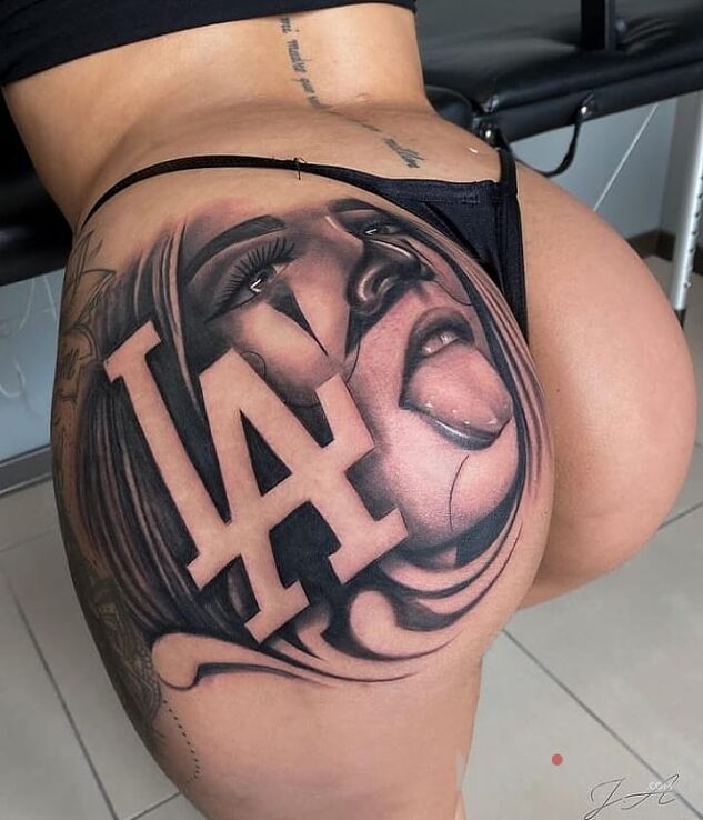 Tattoo Laska z LA in black and gray motif and realistic style on the buttocks