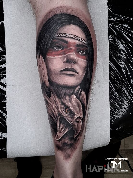 Tattoo Indianka in black and gray motif and realistic style on the calf