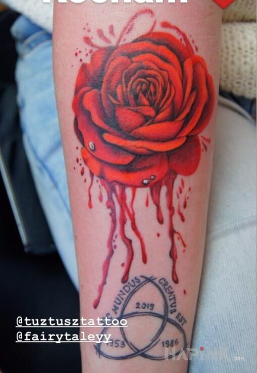 Tattoo Krwawa 🌹 in floral motif and realistic style on the forearm