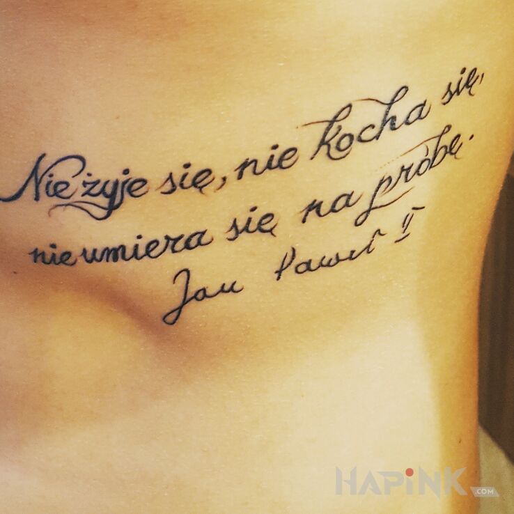 Tattoo Jan Paweł II in lettering motif on the ribs