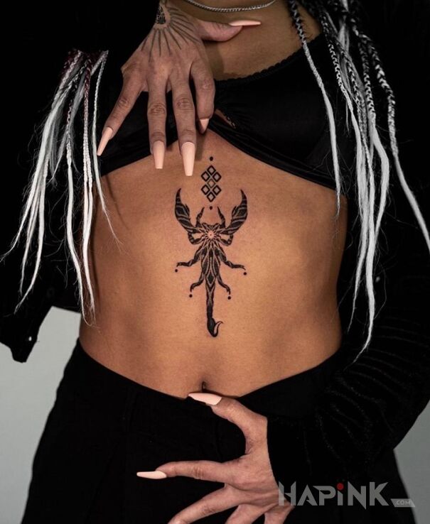 Tattoo Skorpion na inny sposob in black and gray motif and graphic / illustrative style on the stomach