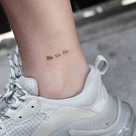 Tattoo Me vs me on the leg motif: lettering