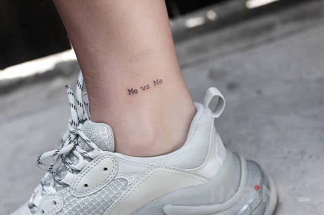 Tattoo Me vs me in lettering motif on the leg