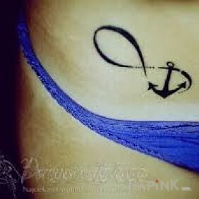 Tattoo Cute looking little tattoo in girls on the stomach motif: Love