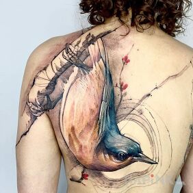 Tattoo Bird on a branch upside down on the shoulder blades motif: animals style: graphic / illustrative