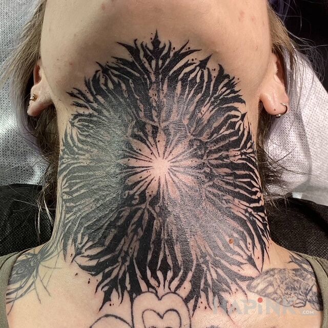 Tattoo MANDALE in mandalas motif and blackwork / blackout style on the throat