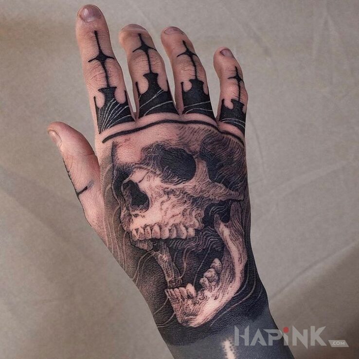 Tattoo Dead king in black and gray motif and realistic style on the hand