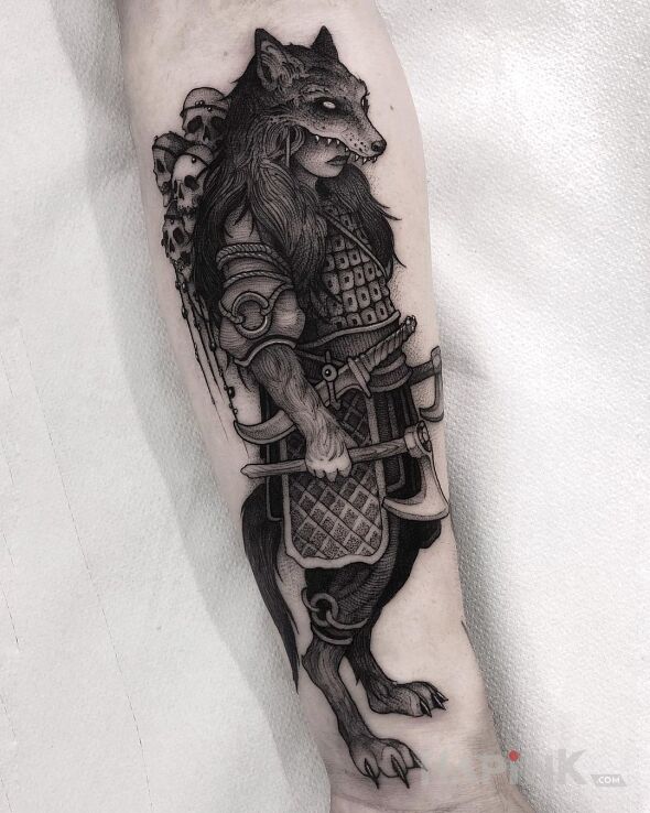 Tattoo Wilczy wojownik in black and gray motif and graphic / illustrative style On the arm