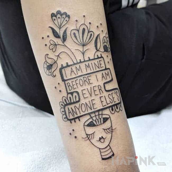 Tattoo Należę do siebie in lettering motif and graphic / illustrative style on the forearm