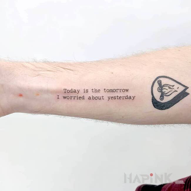 Tattoo Wczoraj dzisiaj jutro in lettering motif On the arm