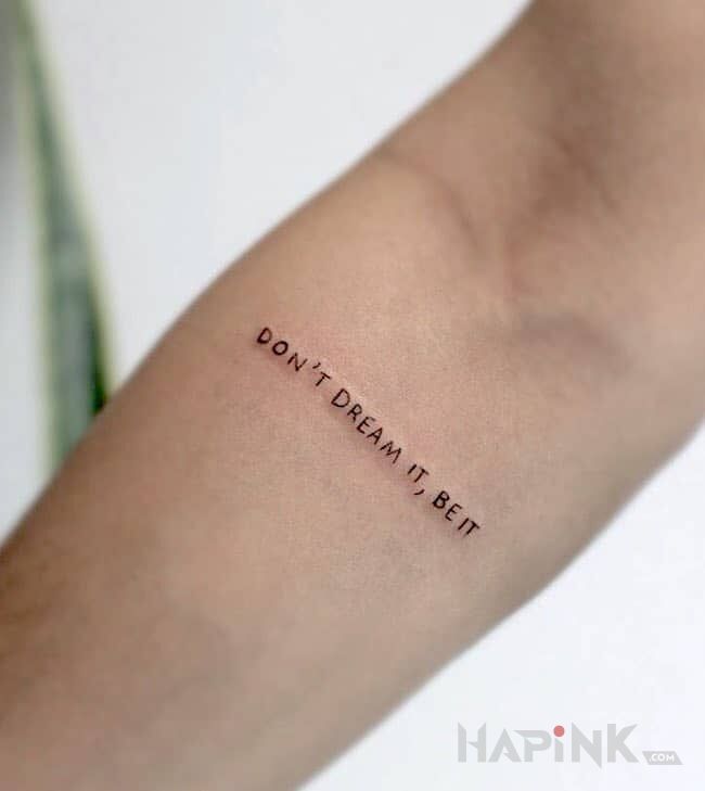Tattoo Dobra rada dla każdego in lettering motif On the arm
