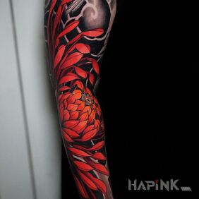 Tattoo Red chrysanthemum on the upper arm motif: flowers style: japanese / irezumi