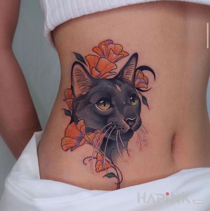 Tattoo Czarny kociak in flowers motif and neo-traditional style on the stomach